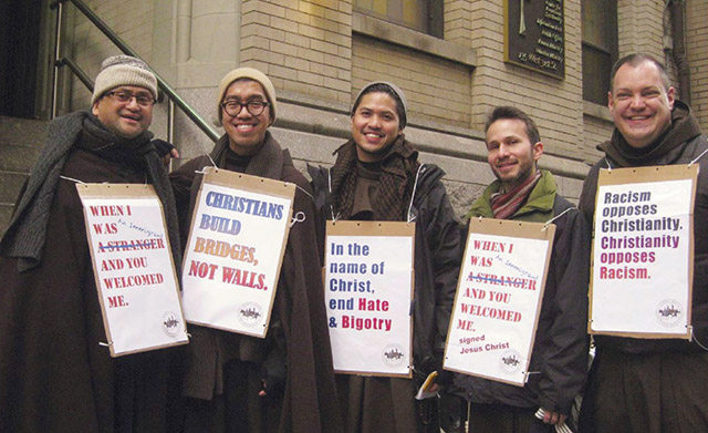 Father Julian Jagudilla, O.F.M. (far left) advocates for immigrant rights with members of his religious community.